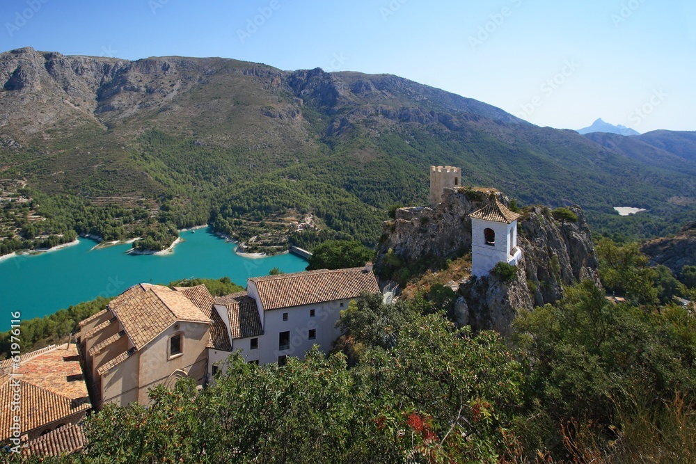 Guadalest lake and village. Reservoir and tiled roofs.