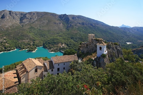 Guadalest lake and village. Reservoir and tiled roofs.