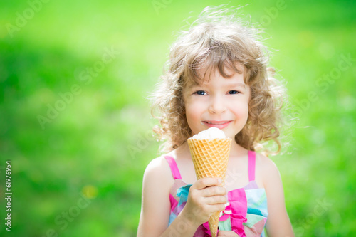 Happy child eating ice cream