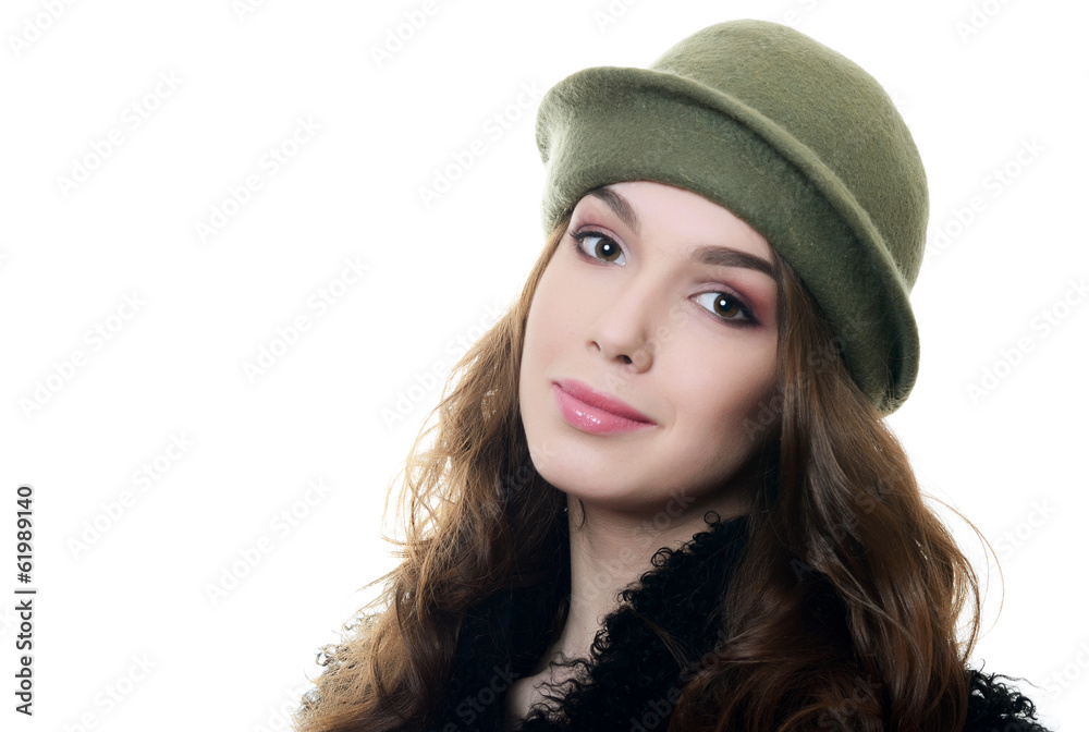The young beautiful woman in an autumn beret on a head