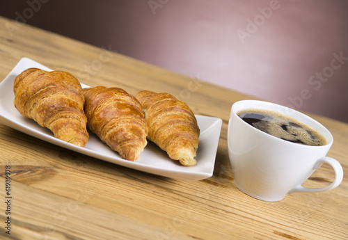 Hot Coffee with fresh croissants with chocolate