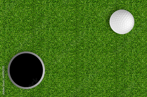 golf ball and hole on the green grass of the golf course