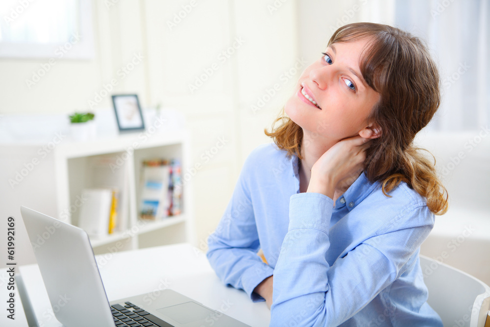 Portrait of young smiling business woman relaxing at work Portrait of young smiling business woman relaxing at work