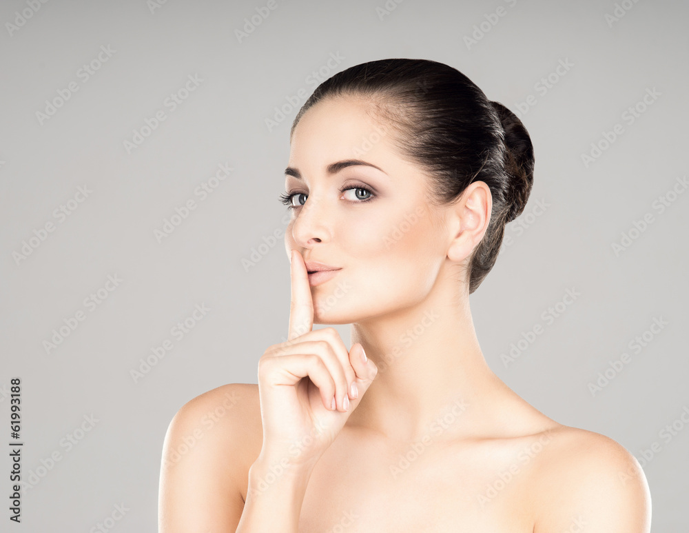 A healthy and sensual girl on a grey background A healthy and sensual girl on a grey background