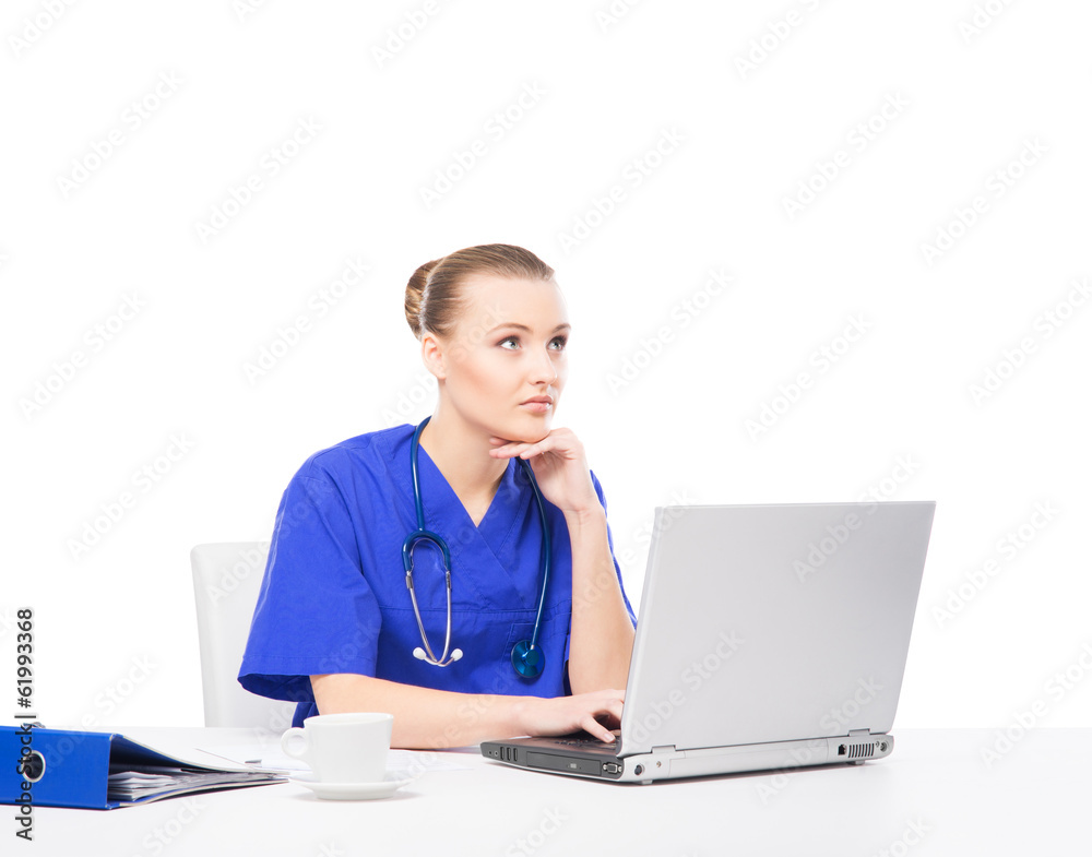 A cheerful female doctor working in office isolated on white A cheerful female doctor working in office isolated on white