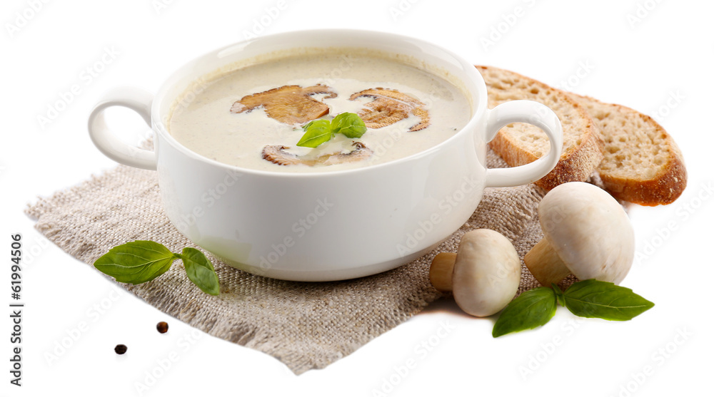 Mushroom soup in white bowl, on napkin, isolated on white Mushroom soup in white bowl, on napkin, isolated on white
