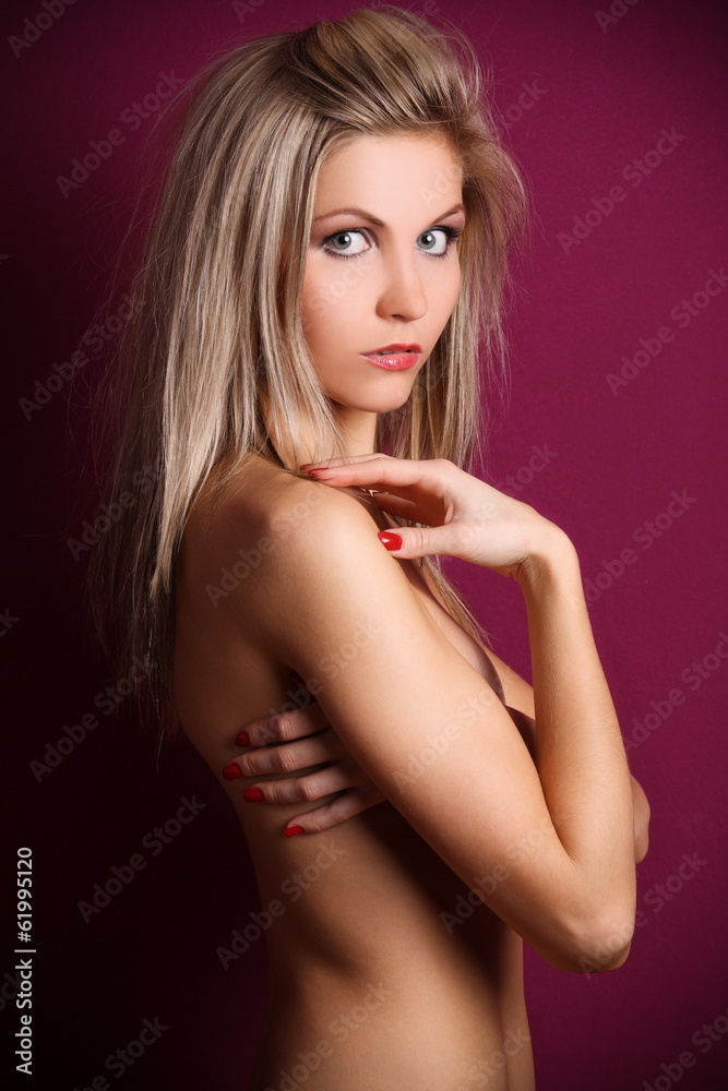 Naklejka premium Beautiful blonde topless in the studio