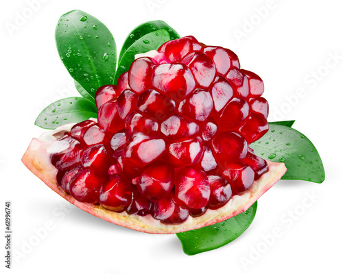 Pomegranate with leaves. Piece isolated on white background photo