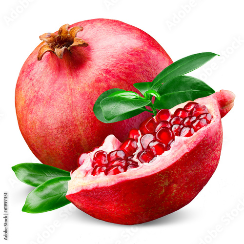 Ripe pomegranate with leaves isolated on a white background photo