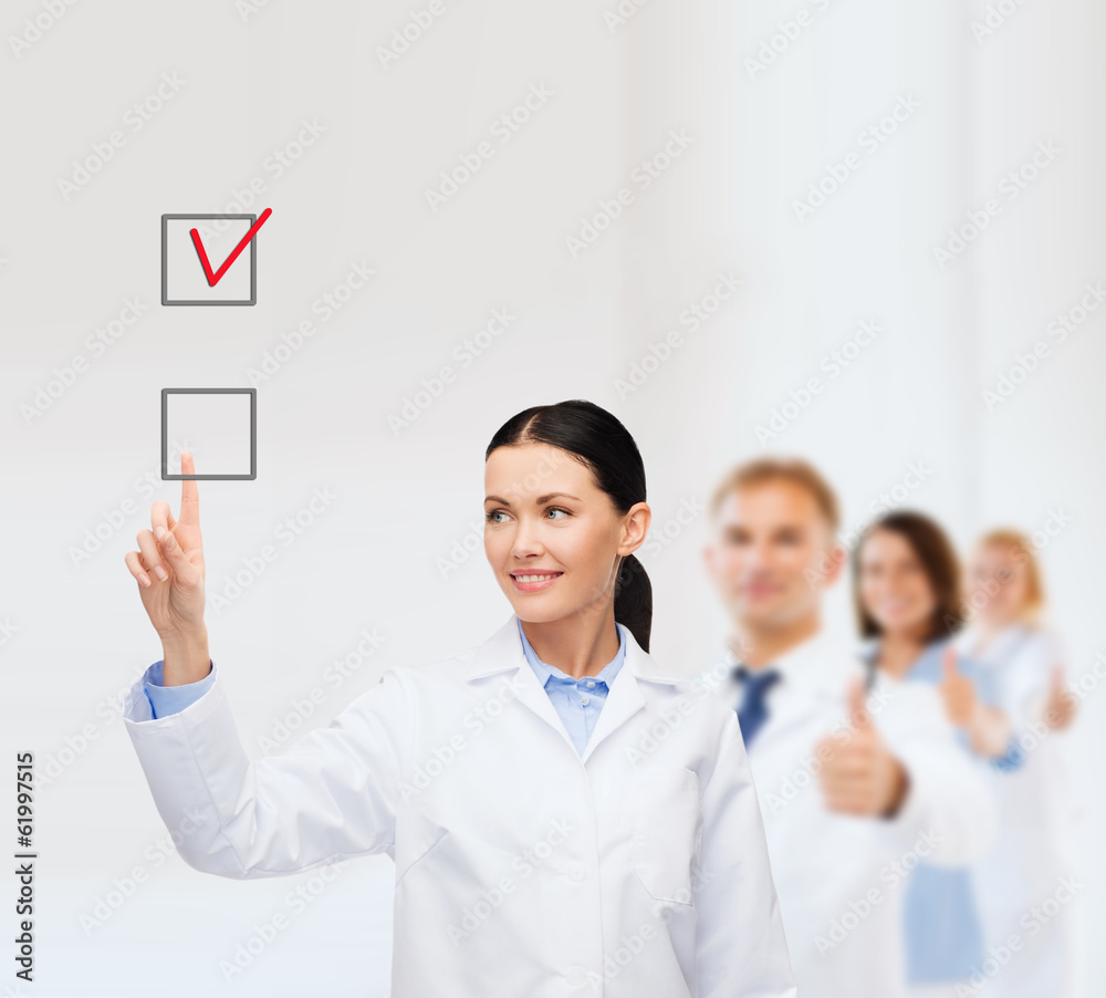 smiling female doctor pointing checkbox smiling female doctor pointing checkbox