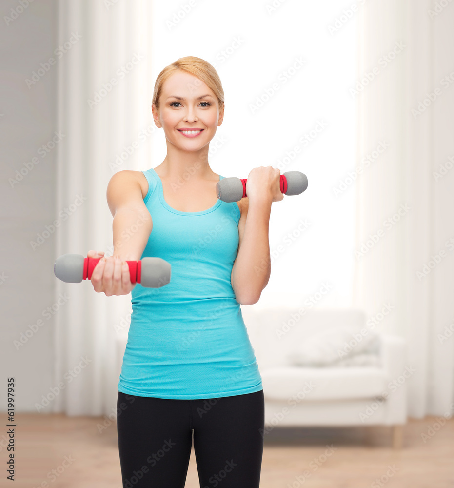 young sporty woman with light dumbbells young sporty woman with light dumbbells