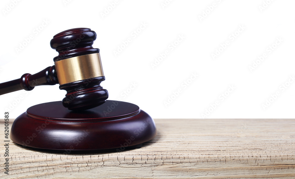 Judge gavel and soundboard on wooden table isolated on white Judge gavel and soundboard on wooden table isolated on white