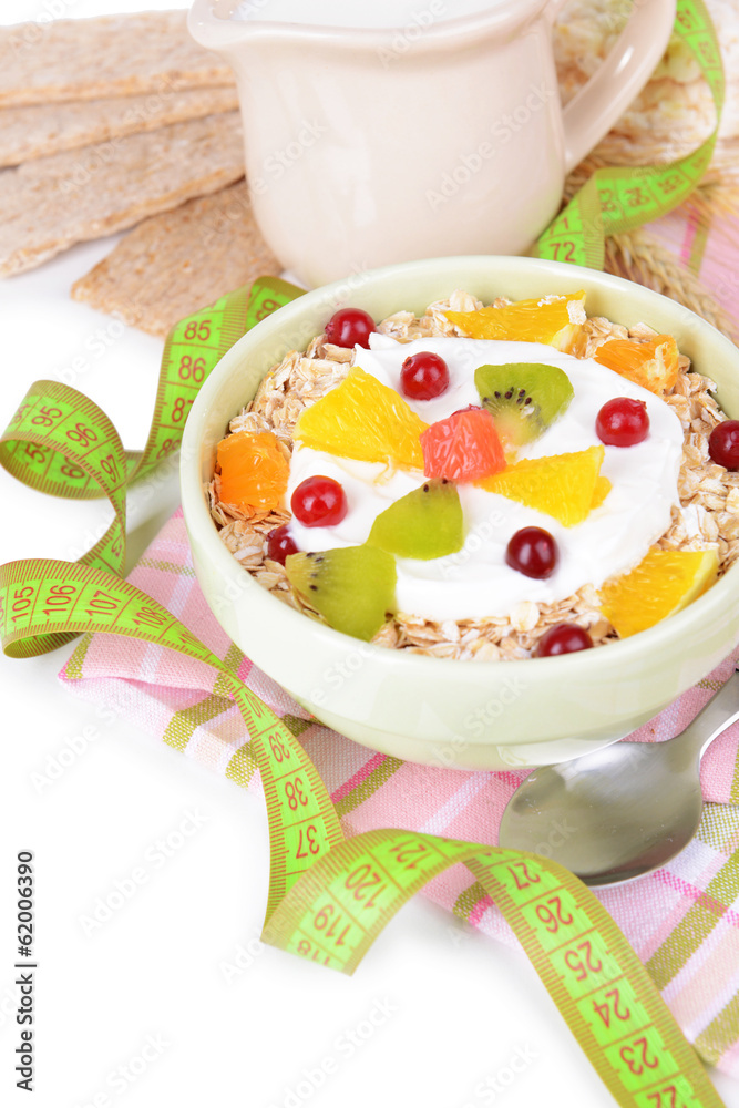 Delicious oatmeal with fruit in bowl on table close-up Delicious oatmeal with fruit in bowl on table close-up
