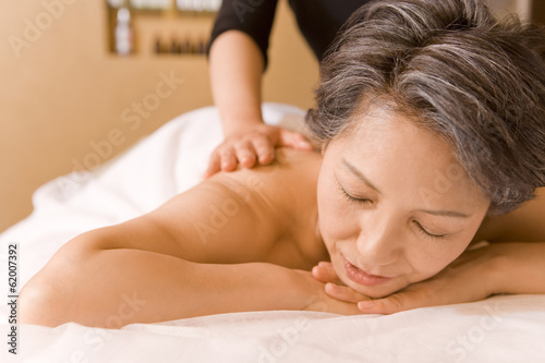 senior woman getting massage