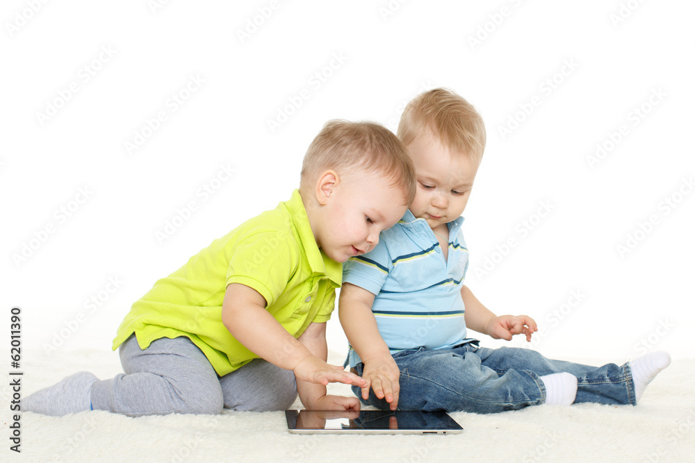 Small children with computer tablet.. Small children with computer tablet..