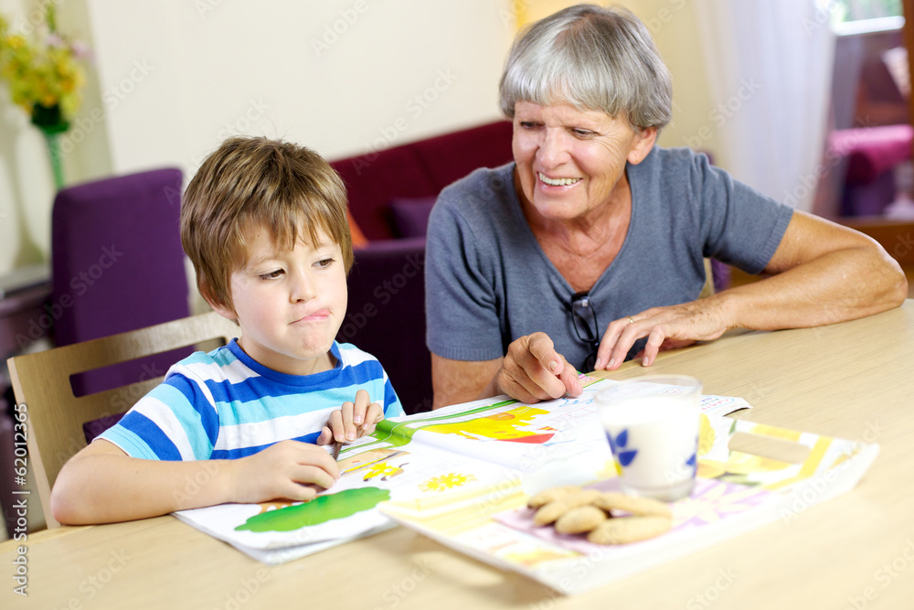 Happy child ready to relax with biscuits during homework Happy child ready to relax with biscuits during homework
