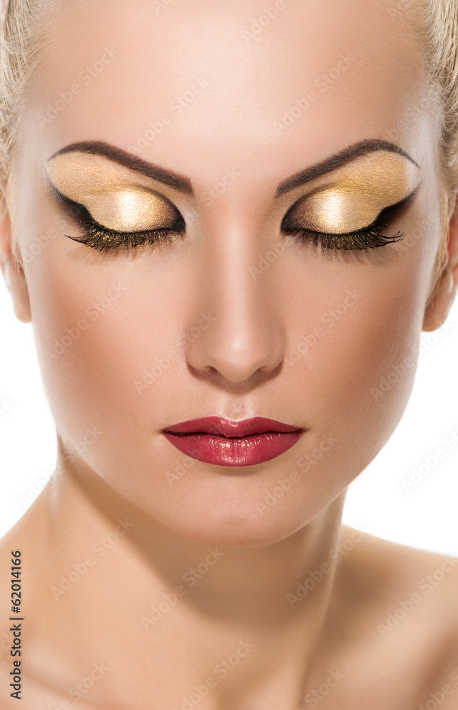 face of young woman with makeup on white background face of young woman with makeup on white background