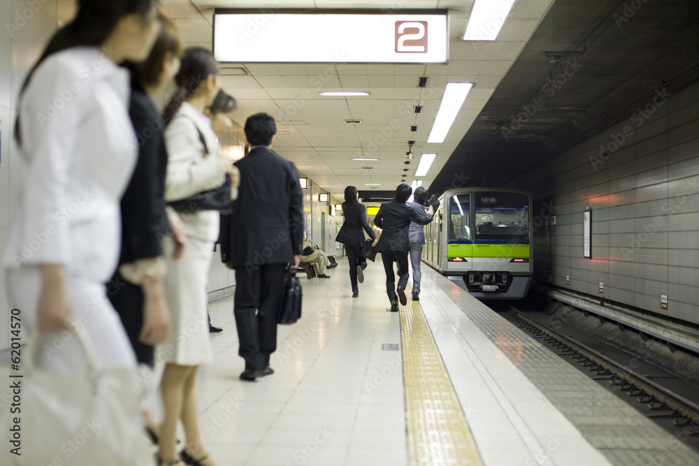 businessman running after train on the platform businessman running after train on the platform
