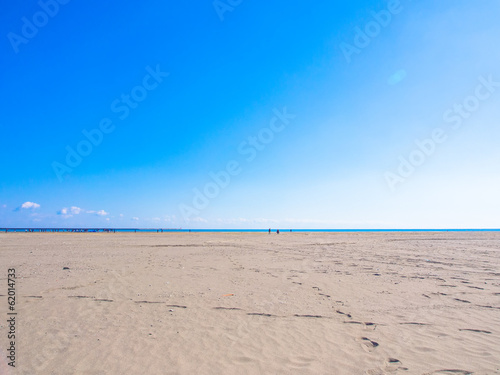 Shining blue sky  sea and sand beach