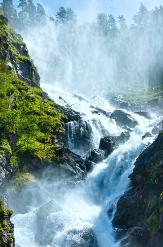 Summer Latefossen waterfall on mountain slope  Norway .