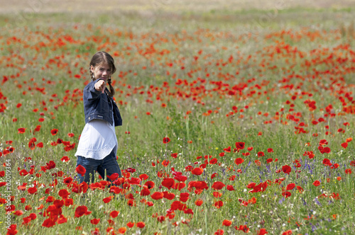 Girl with poppies pointing