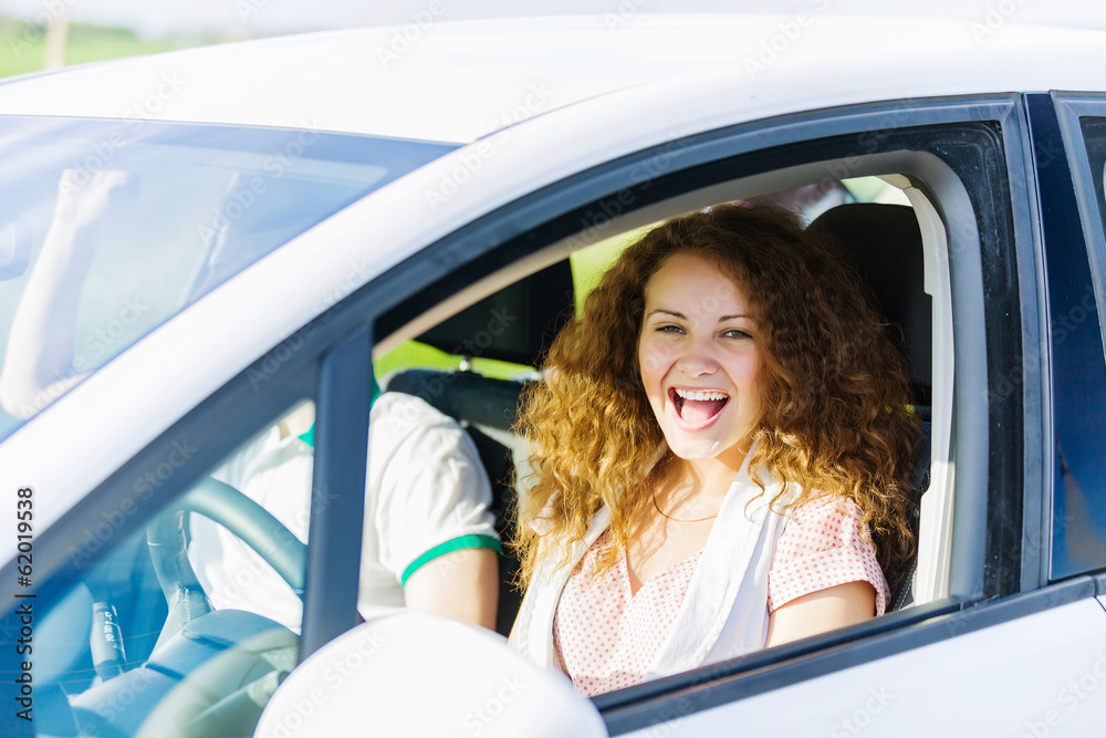 Naklejka premium Woman driving car