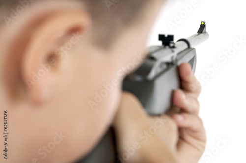 Boy targeting with airgun horizontal photo