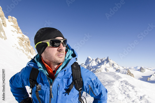 Alpinist looking at mountains