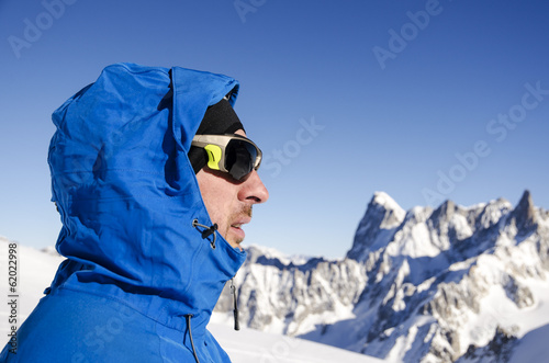 Alpinist looking at mountains photo