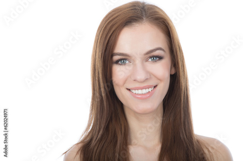 Head and shoulders studio portrait of a smiling woman. Isolated.