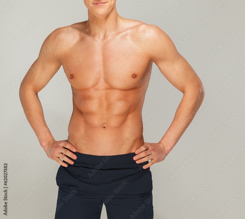 Fototapeta premium Young man's muscular torso