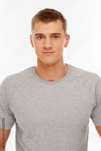 Handsome young man in grey t-shirt © Nejron Photo