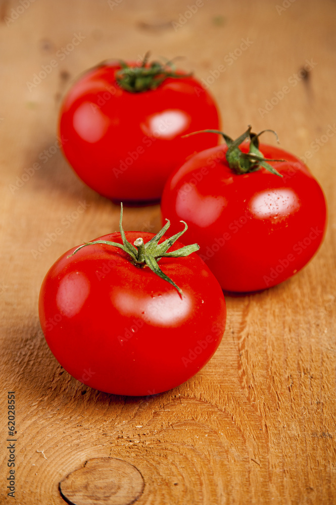 Tomatoes, cooked with herbs for the preservation on the old wood Tomatoes, cooked with herbs for the preservation on the old wood