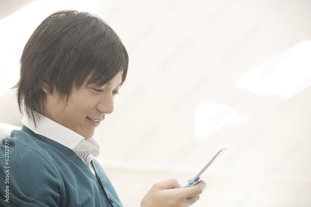 man looking at mobile phone man looking at mobile phone