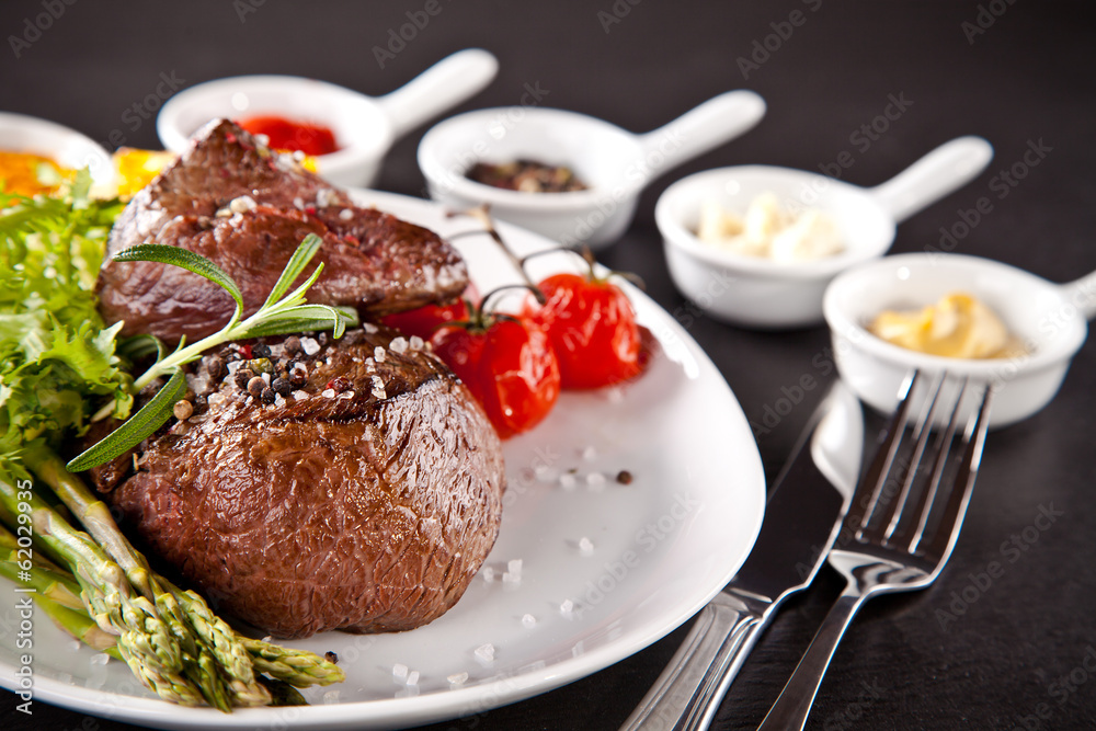 Fresh beef steak on black stone Fresh beef steak on black stone