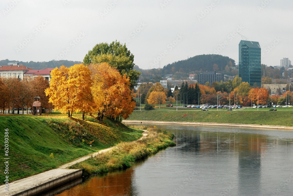 Neris river in Vilnius, Lithuania, with autumn forest Neris river in Vilnius, Lithuania, with autumn forest