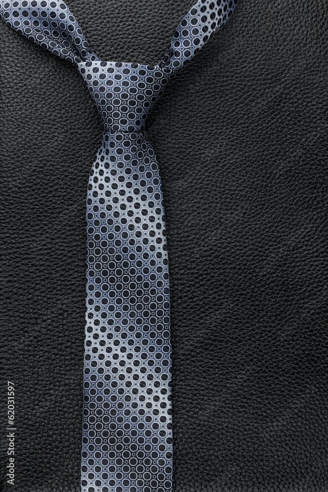 Men's tie lies on the natural leather Men's tie lies on the natural leather
