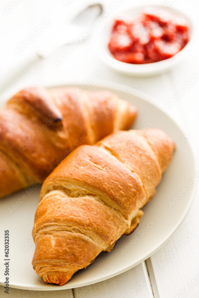 two croissants on wooden table