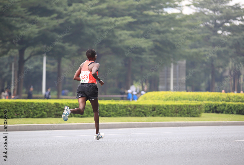marathon athletes legs running on street marathon athletes legs running on street