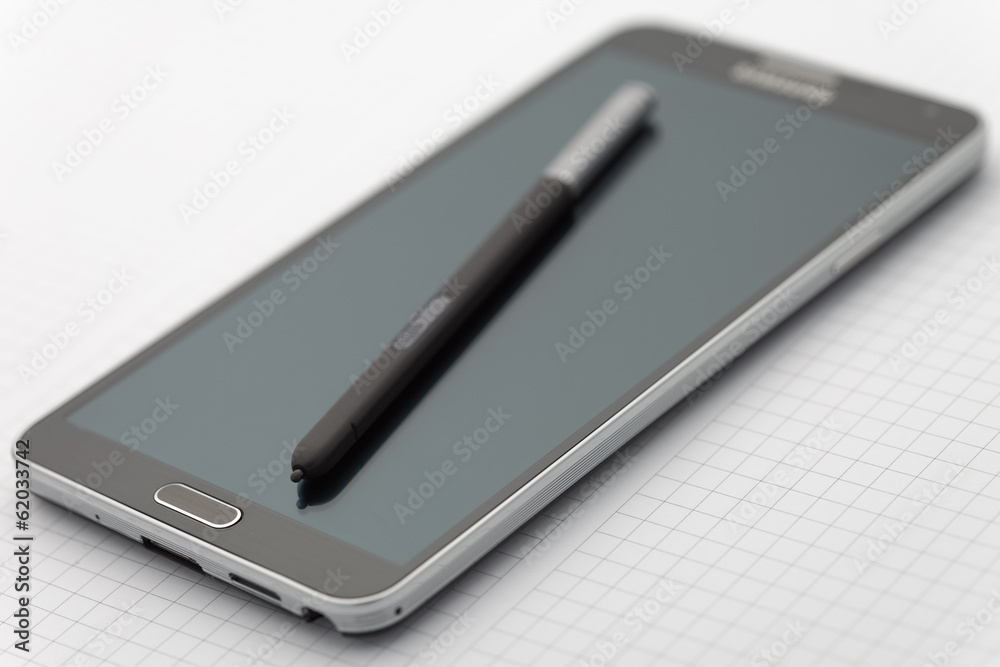 Phablet with selective focus on stylus pen Phablet with selective focus on stylus pen