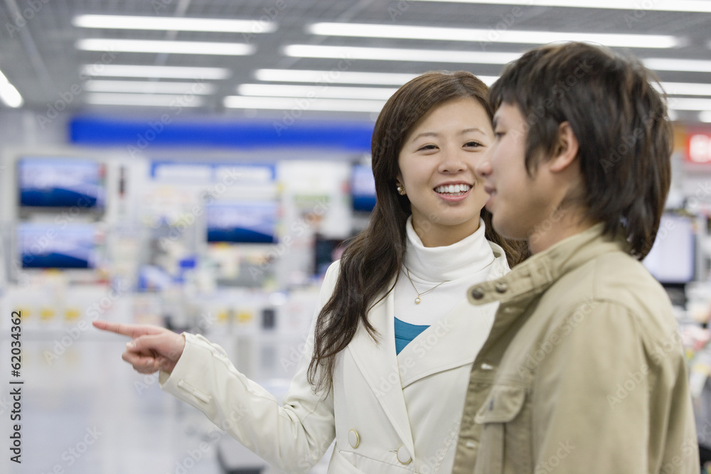 © TAGSTOCK2 - couple doing some shopping in an electrical appliance shop