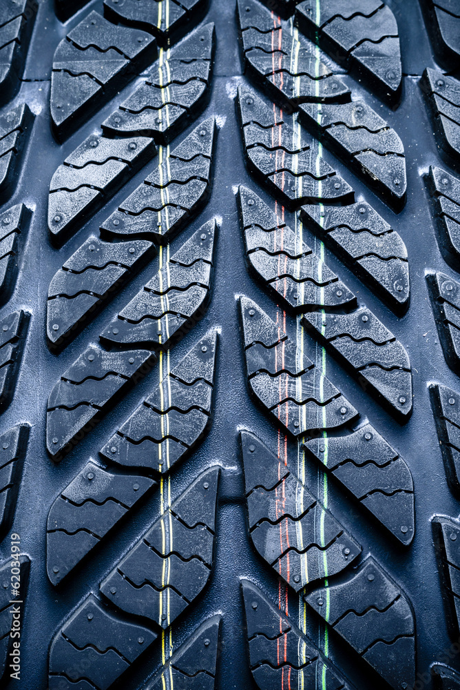 Fragment of new vehicle, car tyre, tire.