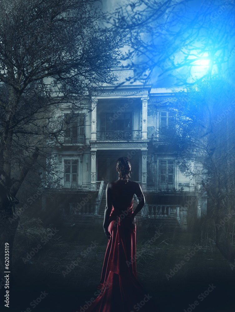 Woman in red dress at haunted house