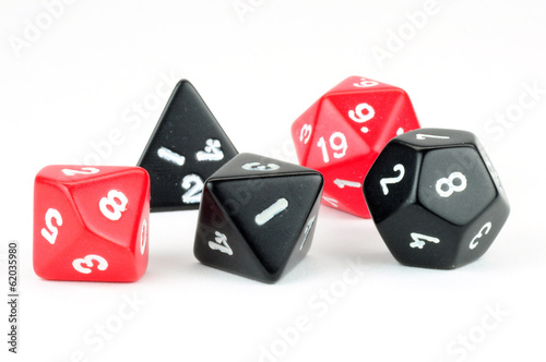 Macro photo of five black and red dice on white