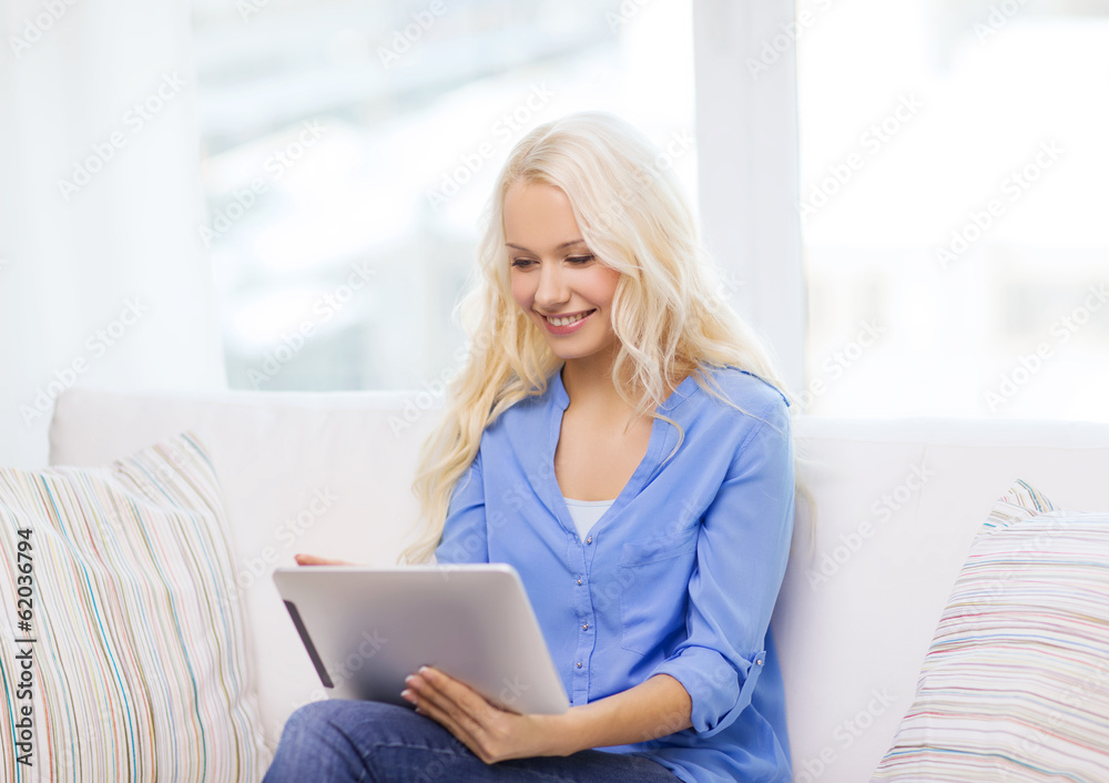smiling woman with tablet pc computer at home smiling woman with tablet pc computer at home