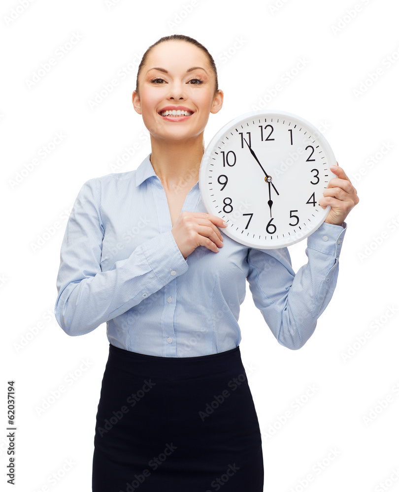 attractive businesswoman with wall clock