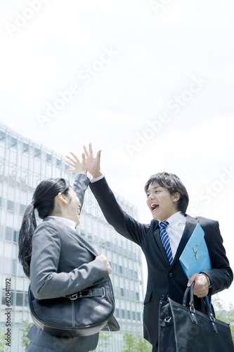 man and woman doing high five