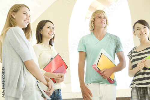 Принти на полотні students standing still at hallway of school