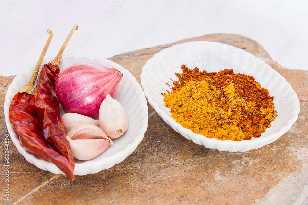 Peppers, onions, garlic, spices, stone white background. Peppers, onions, garlic, spices, stone white background.