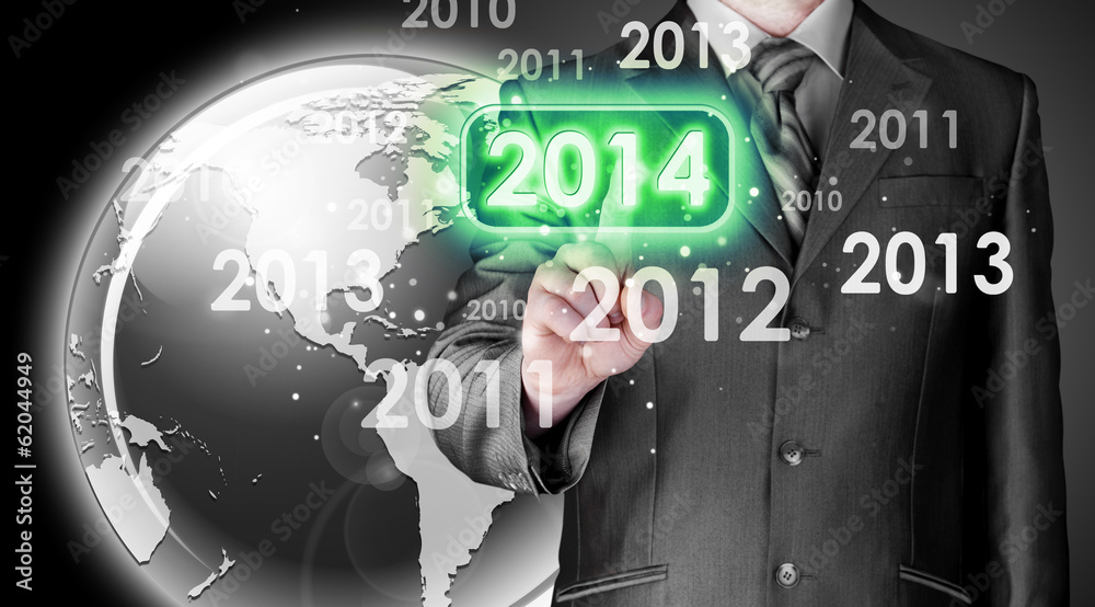 Businessman touching new year 2014 Businessman touching new year 2014